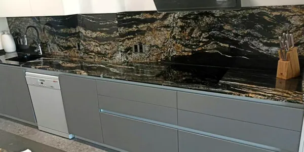 Kitchen in black stone with golden veins